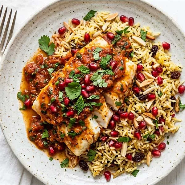 Spiced tomato fish with pomegranate pilaf